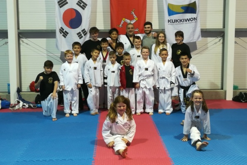 Senior instructor Christopher Lawlor (back middle) with students at Flying Phoenix Taekwondo