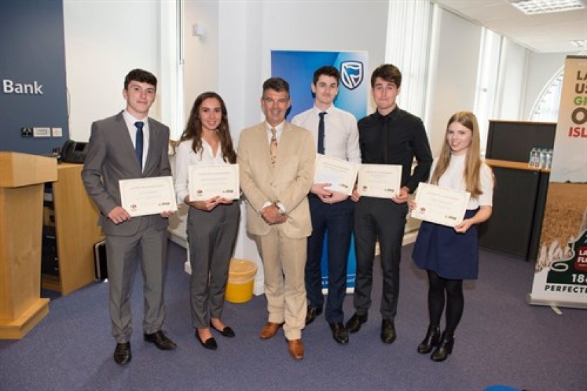 Students from last year's programme with Economic Development Minister Laurence Skelly.