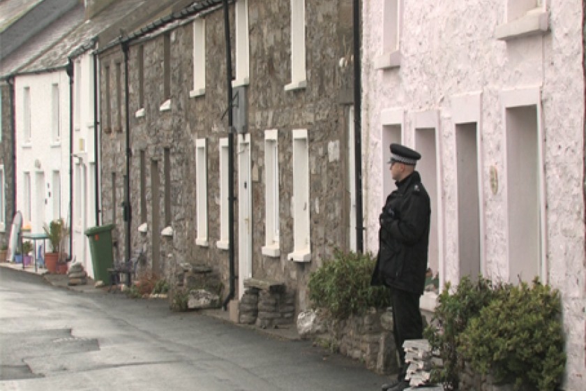 A police officer on duty near the scene in Castletown today 