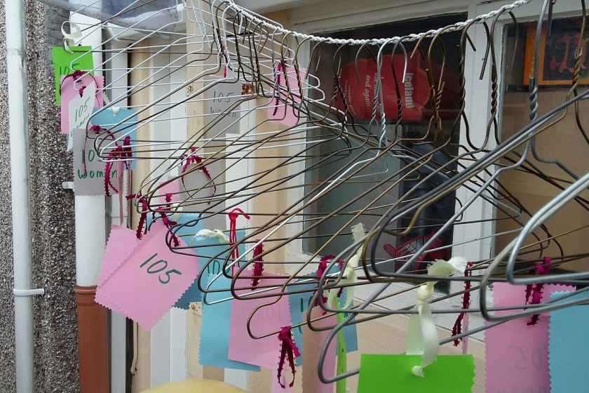 Coat hangers represent the 105 women who went to the UK for an abortion last year