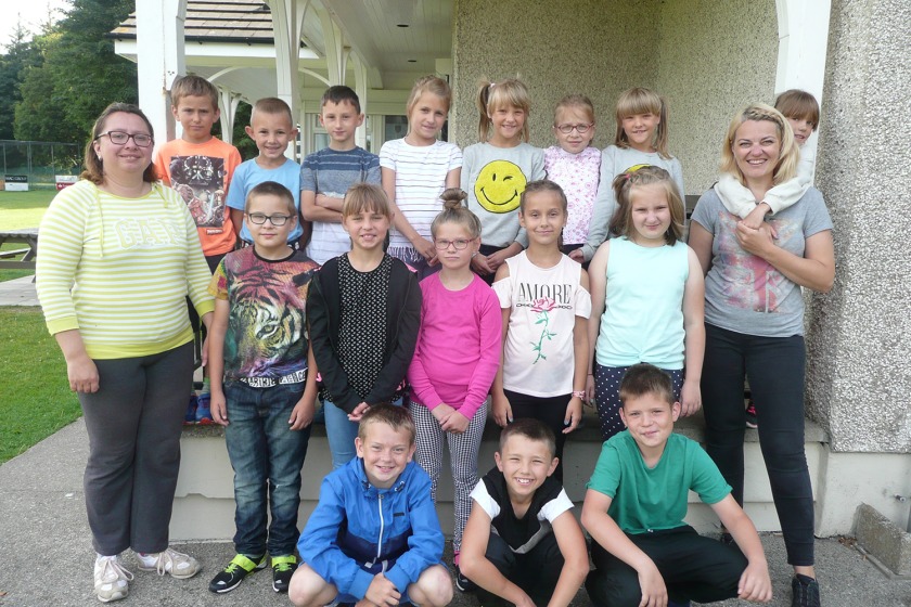 Interpreters Olyia Sapunova (left) and Irina Zuzina (right) with some of the visiting children from Belarus in 2018