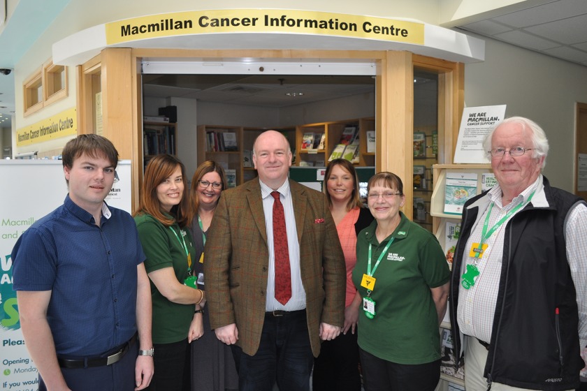 Health and Social Care Minister Howard Quayle (C) with the Macmillan team