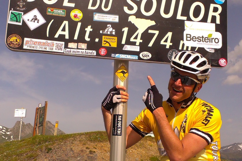 Cyclist Paul Warburton takes a break at the top of the Col du Soulor.