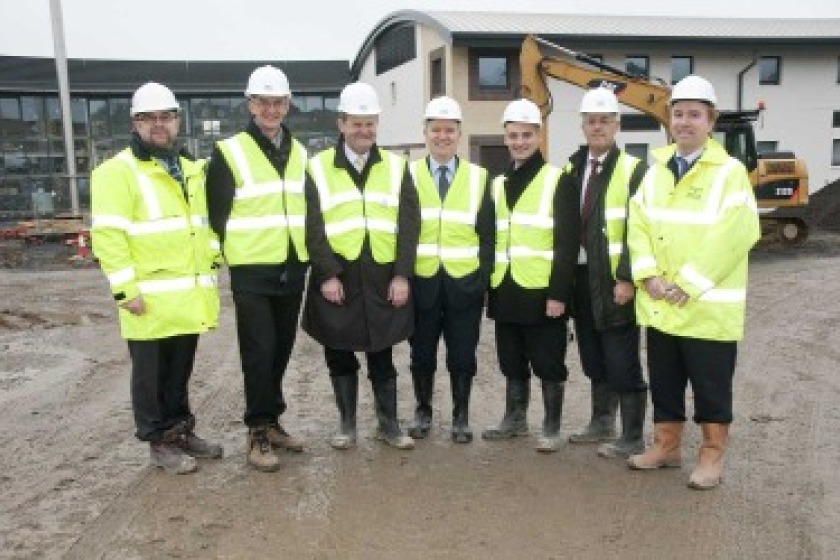 Political members and staff from the Department of Education and Children visiting the site
