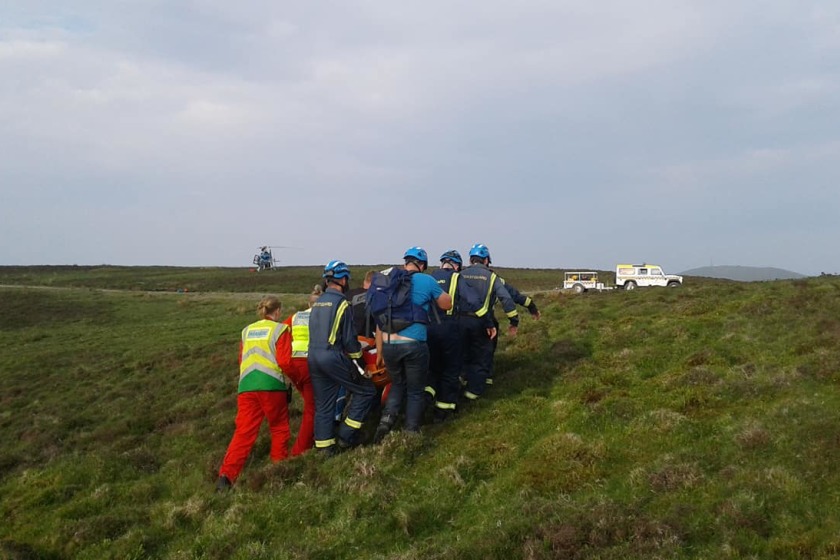 Peel Coastguard and the rider's friends helped winch the stretcher to the medical helicopter.