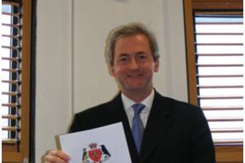 First Deemster David Doyle with the new Code of Conduct for Members of the Judiciary of the Isle of Man