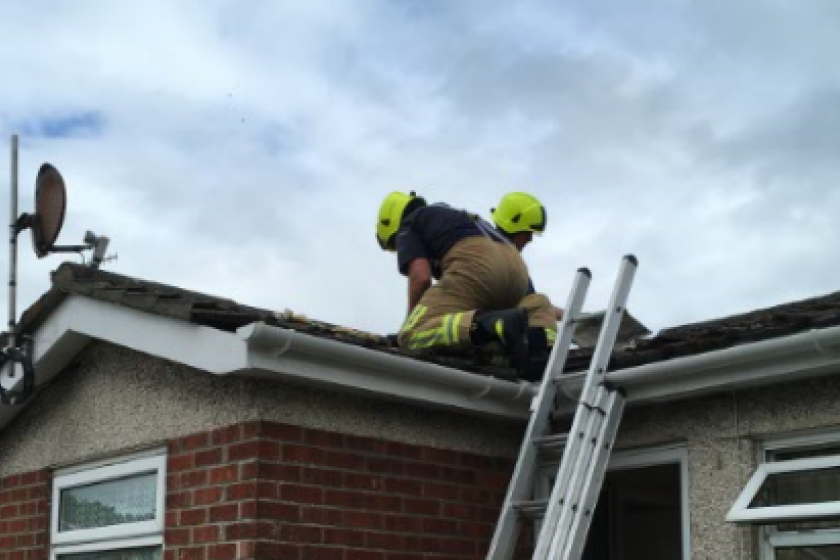 The man became trapped in a roof void while carrying out cabling work.
