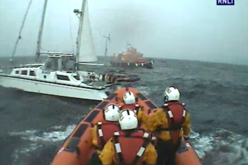Lifeboat crews reach the sinking yacht 