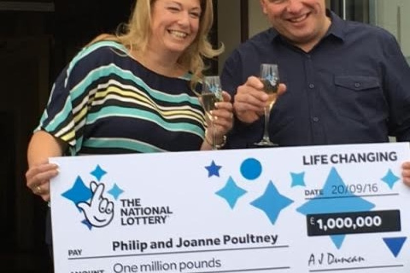 Joanne and Philip Poultney receive their winning cheque.