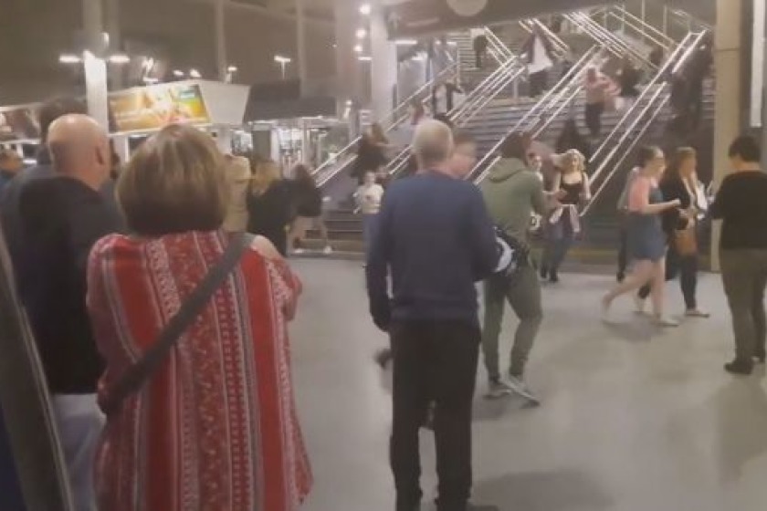 People fleeing the Manchester Arena following the explosion that killed 22 people and injured many more. (BBC)