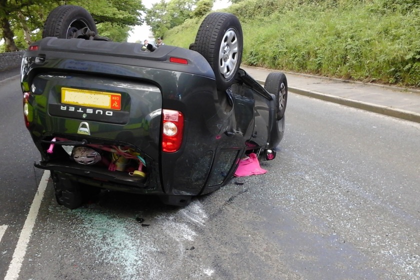 A woman and two children were in the car when it overturned following a collision in Santon this morning.